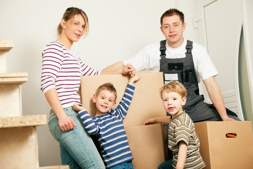 A moving team preparing items safely before loading a van