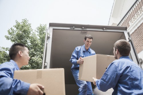 Removal team loading furniture for a home move in Chingford