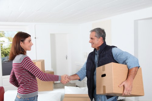 A staff member assessing access and handling risks during a move