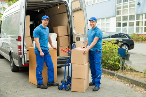 Van transport team handling household items safely