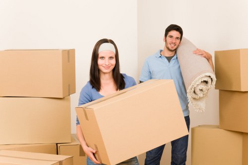 Removal team handling furniture and boxes during a Chingford move