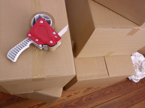 Packed boxes and moving equipment prepared for a local relocation