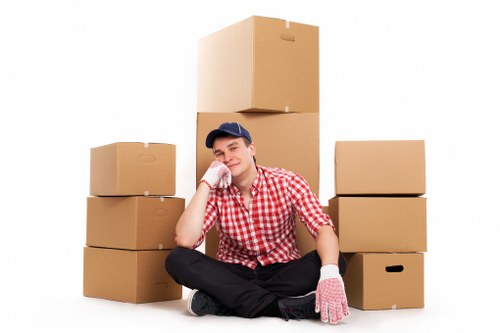 Furniture and boxes being prepared for transport by moving truck in Chingford